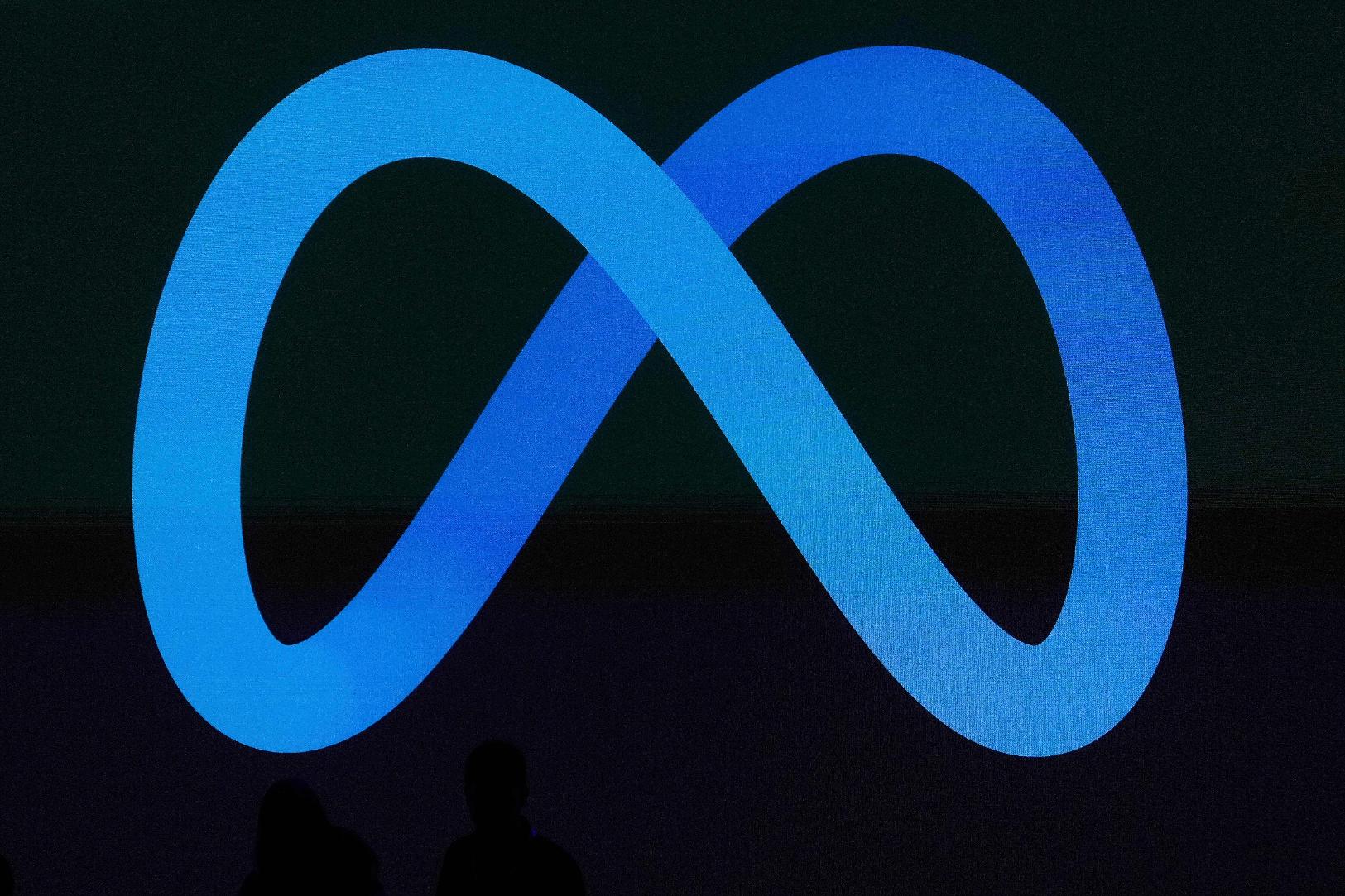 FILE - A Meta logo is shown on a video screen at LlamaCon 2025, an AI developer conference, in Menlo Park, Calif., April 29, 2025. (AP Photo/Jeff Chiu, File)