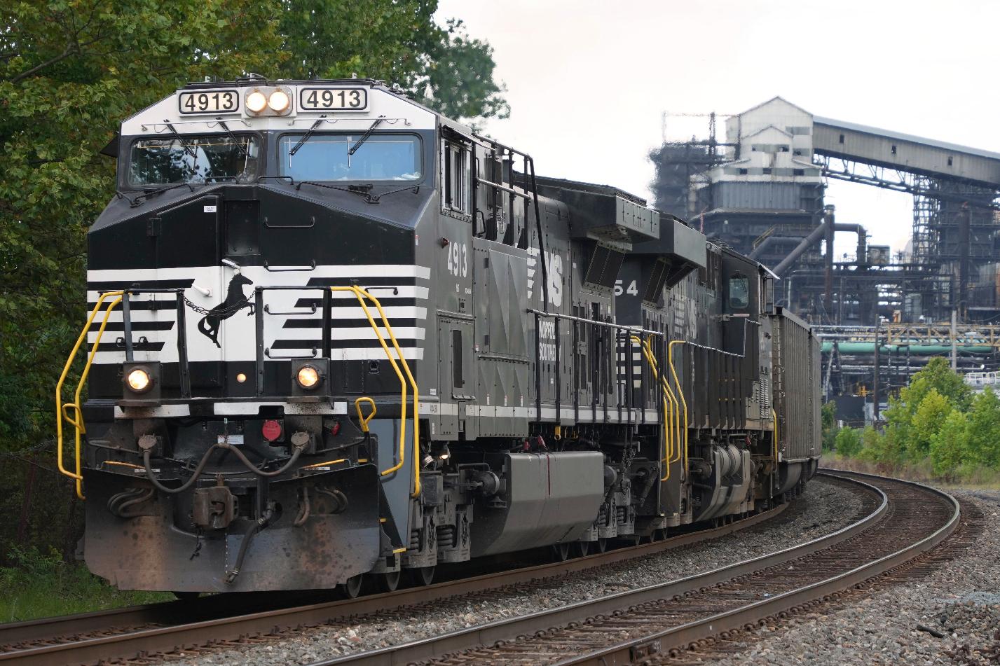 FILE - A Norfolk Southern freight train rolls past the U.S. Steel's Clairton Coke Works, in Clairton, Pa., Tuesday, Aug. 12, 2025. (AP Photo/Gene J. Puskar, File)