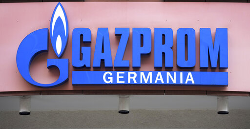 FILE - The logo of 'Gazprom Germania' is pictured at the company's headquarters in Berlin, April 6, 2022. Russian state-controlled energy giant Gazprom says gas deliveries through a key pipeline to Europe will drop by around 40% this year. The dpa news agency reports Tuesday, June 14 that Germany’s utility network agency said it didn't see gas supplies as endangered and that reduced amounts through the Nord Stream 1 pipeline under the Baltic Sea aligned with commercial behavior and the previously announced cutoff of gas to Denmark and the Netherlands. (AP Photo/Michael Sohn, File)