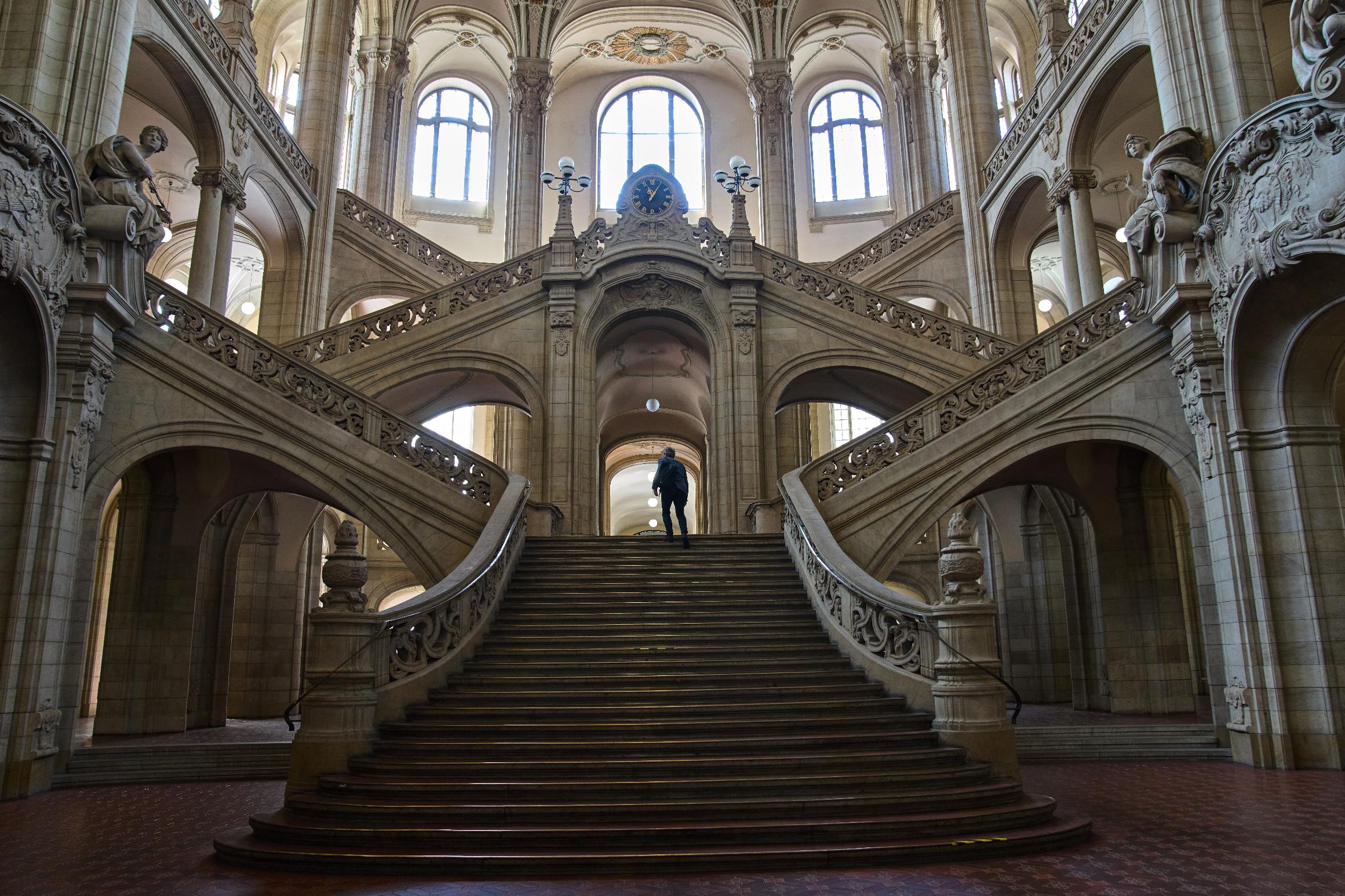 A man walks in the court on the day of the trial against an online predator network of men accused of using chat groups to share tips on how to drug and rape women, in Berlin, Germany, Wednesday, July 8, 2026. (AP Photo/Ebrahim Noroozi)