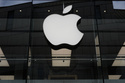 FILE - The Apple logo is illuminated at a store in Munich, Germany, April 2, 2026. (AP Photo/Matthias Schrader, File)