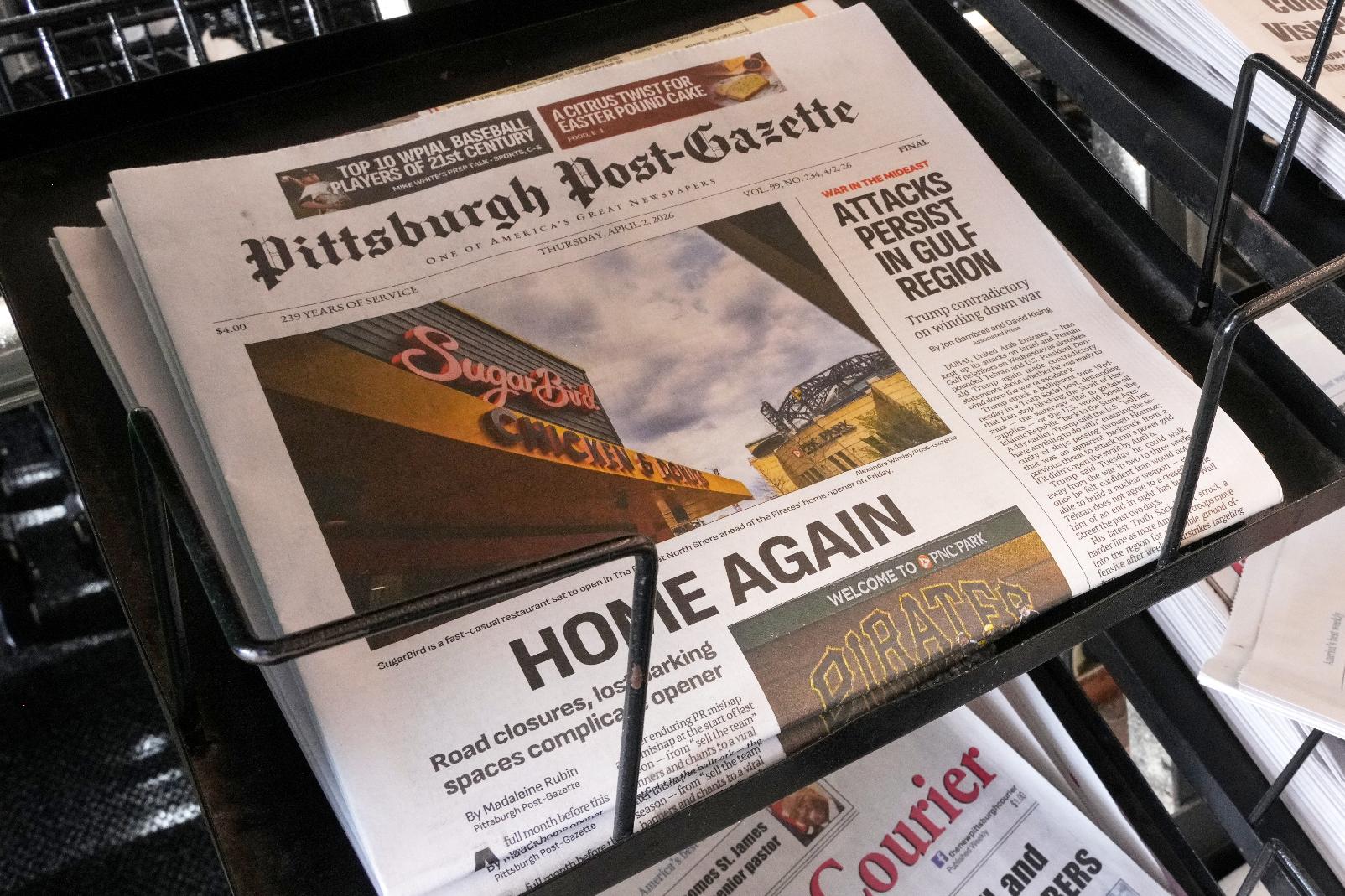 The printed edition of the Pittsburgh Post-Gazette sits in a newspaper rack, Thursday, April 2, 2026, in Pittsburgh. (AP Photo/Gene J. Puskar)