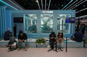 Visitors take rest near a chamber with sub-zero temperatures that showcases the battery charging technologies from Chinese automaker BYD at the Auto China 2026, in Beijing, Saturday, April 25, 2026. (AP Photo/Andy Wong)