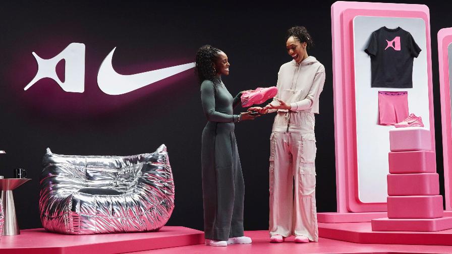 In this photo provided by Nike in July 2025, Issa Rae, left, and WNBA player A'ja Wilson look at an A'One shoe in Columbia, S.C. (Nike via AP)