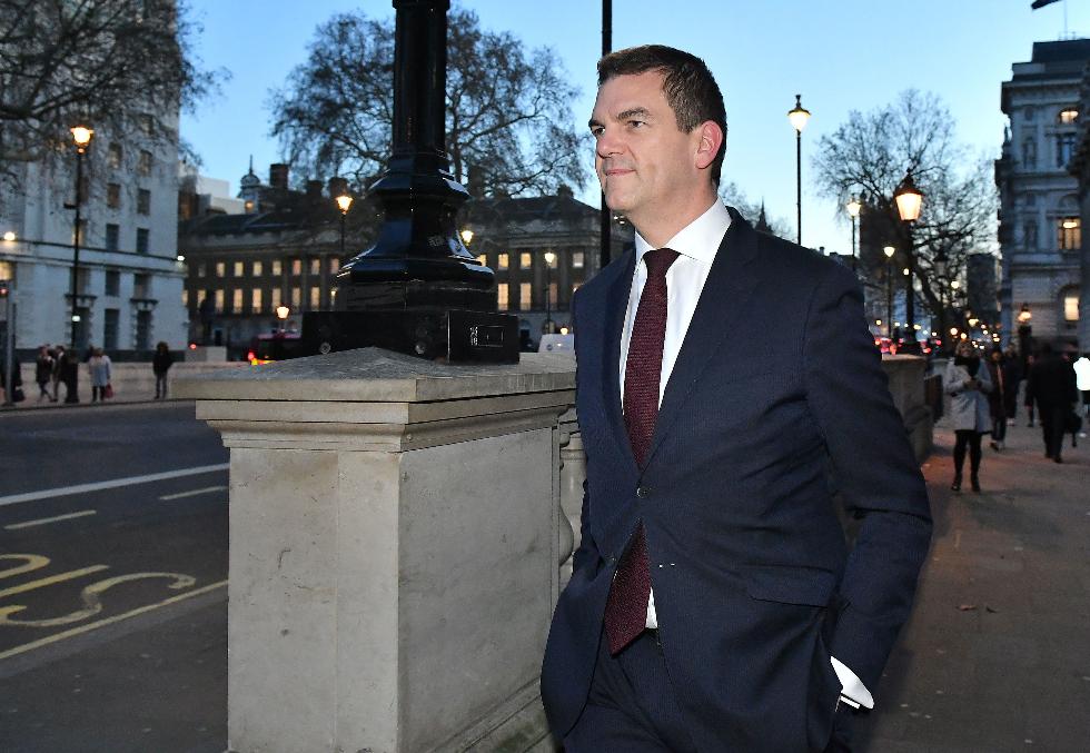 FILE - Olly Robbins walks on Whitehall in Westminster, London, Jan. 17, 2019. (Dominic Lipinski/PA via AP, File)