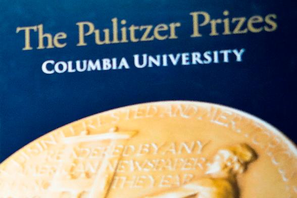 FILE - Signage for The Pulitzer Prizes appear at Columbia University, May 28, 2019, in New York. (AP Photo/Bebeto Matthews, File)