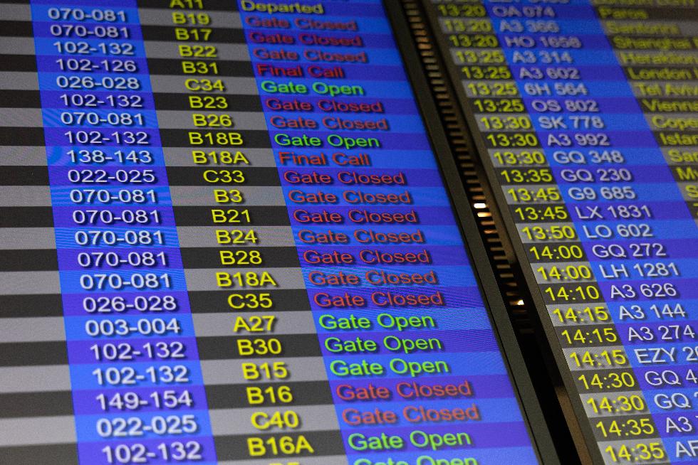 A flight information board is pictured in detail inside Athens' Eleftherios Venizelos international airport in Athens, Greece, Sunday, Jan. 4, 2026, as many flights were disrupted across Greece. (AP Photo/Yorgos Karahalis)