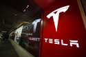 FILE - In this Feb. 9, 2019, file photo, a sign bearing the company logo stands outside a Tesla store in Cherry Creek Mall in Denver. Record electric vehicle sales last summer amid a shortage of computer chips and other materials propelled Tesla Inc. to the biggest quarterly net earnings in its history. The company said Wednesday, Oct. 20, 2021 that it made $1.62 billion in the third quarter, beating the old record of $1.14 billion set in the second quarter of this year. The profit was over five times larger than the $300 million Tesla made in the same quarter a year ago. (AP Photo/David Zalubowski, File)