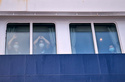 Passengers watch as others are disembarked from the hantavirus-stricken cruise ship MV Hondius at the port of Granadilla in Tenerife, Canary Islands, Spain, Sunday, May 10, 2026. (AP Photo)