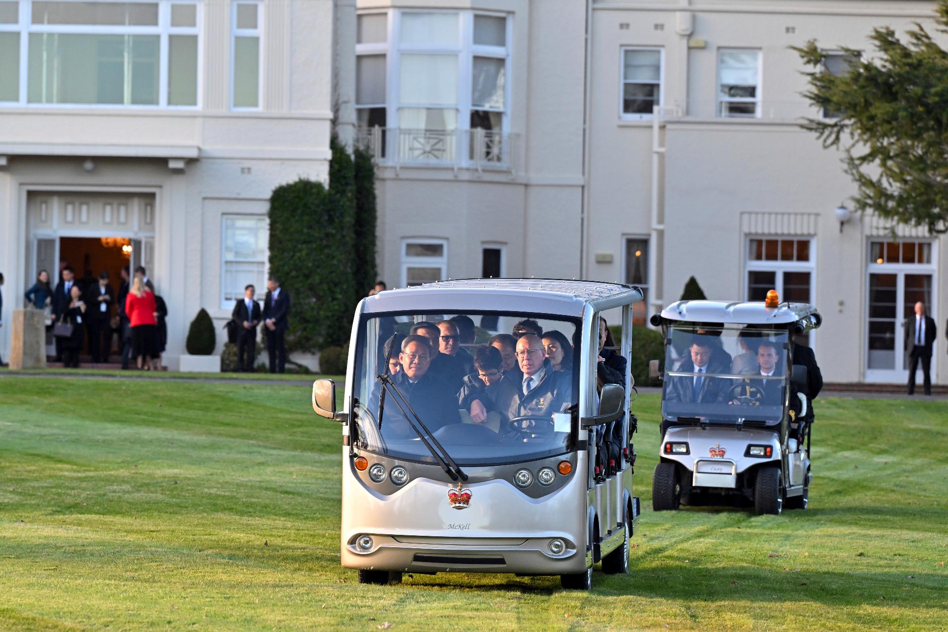 Australia's Governor-General David Hurley drives with China's Premier Li Qiang, left, to look for kangaroos at Government House in Canberra, Monday, June 17, 2024. Li says he has agreed with Australian Prime Minister Anthony Albanese to properly manage their nations' differences as they emerge from a hostile era in which minister-to-minister contacts were banned and trade barriers cost Australian exporters up to $13 billion a year. (Mick Tsikas/Pool Photo via AP)