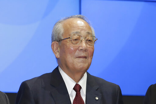FILE - Japan Airlines honorary chairman Kazuo Inamori poses during a ceremony to mark its relisting at the Tokyo Stock Exchange in Tokyo on Sept. 19, 2012. Inamori, founder of Japanese ceramics and electronics maker Kyocera who also became a philanthropist singing the virtues of fairness and hard work, died Aug. 24, 2022 of natural causes at his home in Kyoto, western Japan. He was 90. Inamori also oversaw the revival from bankruptcy of Japan’s major carrier Japan Airlines, or JAL, in 2010, serving as a board member. (AP Photo/Shizuo Kambayashi, File)