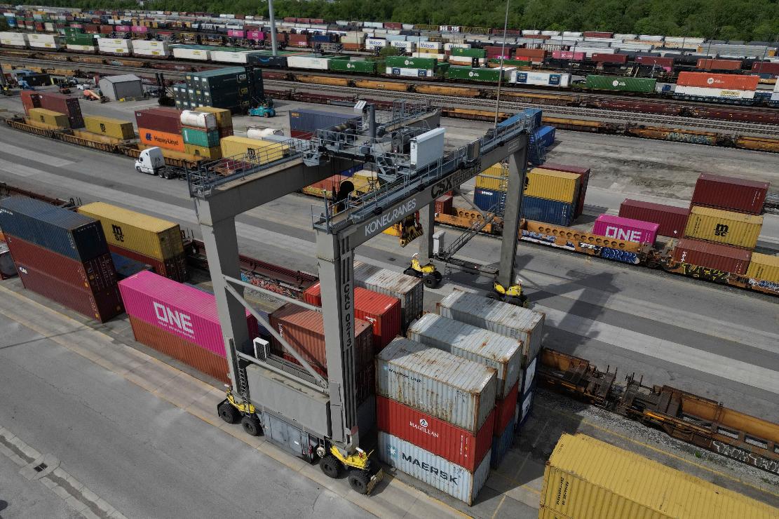 FILE - Shipping containers are lined up near a crane at CSX Intermodal Terminals, a supplier of rail-based freight transportation, at CSX Queensgate Rail Yard, May 7, 2025, in Cincinnati. (AP Photo/Carolyn Kaster, File)