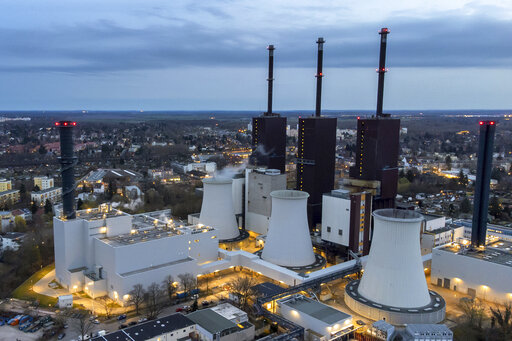 FILE - Steam leaves a cooling tower of the Lichterfelde gas-fired power plant in Berlin, Germany, March 30, 2022. German officials said Wednesday that the country is continuing to export electricity to neighboring France despite calling on citizens to save energy at home due to looming shortages. (AP Photo/Michael Sohn, File)