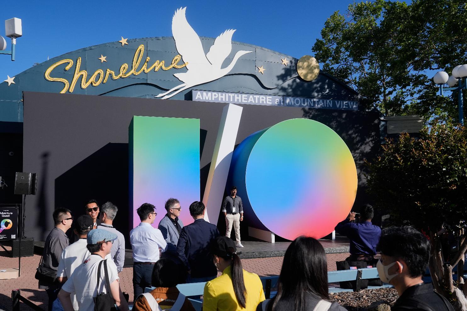 Attendees pose for photos before the keynote presentation at a Google I/O event in Mountain View, Calif., Tuesday, May 19, 2026. (AP Photo/Jeff Chiu)