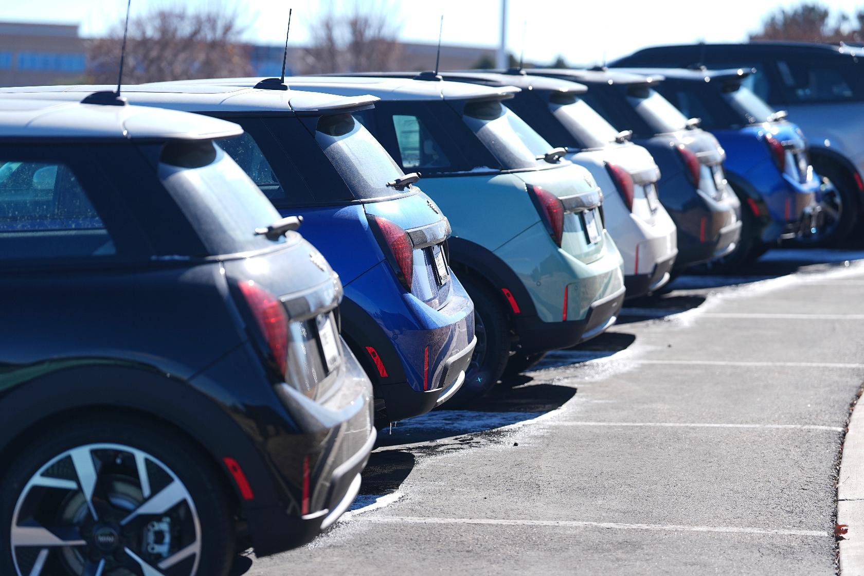 Unsold 2025 Cooper hardtops and Countryman utility vehicles sit on display at a Mini dealership Sunday, Feb. 9, 2025, in Highlands Ranch, Colo. (AP Photo/David Zalubowski)