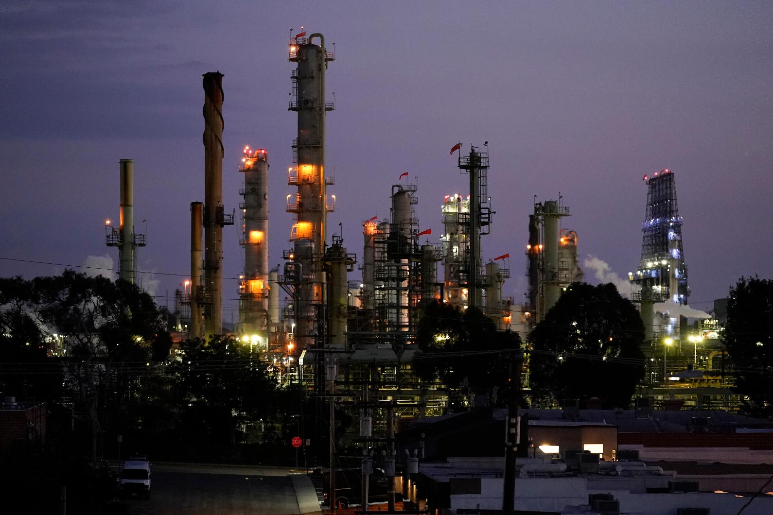 File - The Chevron Products Company El Segundo refinery is seen on Monday, Oct. 23, 2023, in El Segundo, Calif. Chevron posted a third-quarter profit of $6.53 billion, or $3.48 per share. Earnings, adjusted for pretax gains, came to $3.05 per share. (AP Photo/Ashley Landis, File)