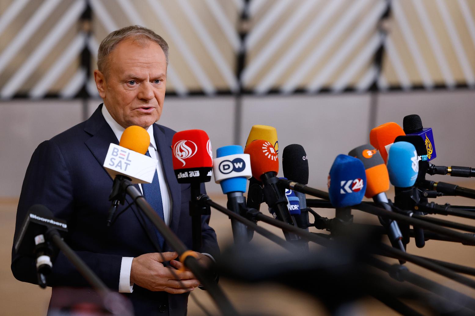 FILE - Poland's Prime Minister Donald Tusk speaks with the media as he arrives for the EU Summit in Brussels, Thursday, Dec. 18, 2025. (AP Photo/Geert Vanden Wijngaert, file)