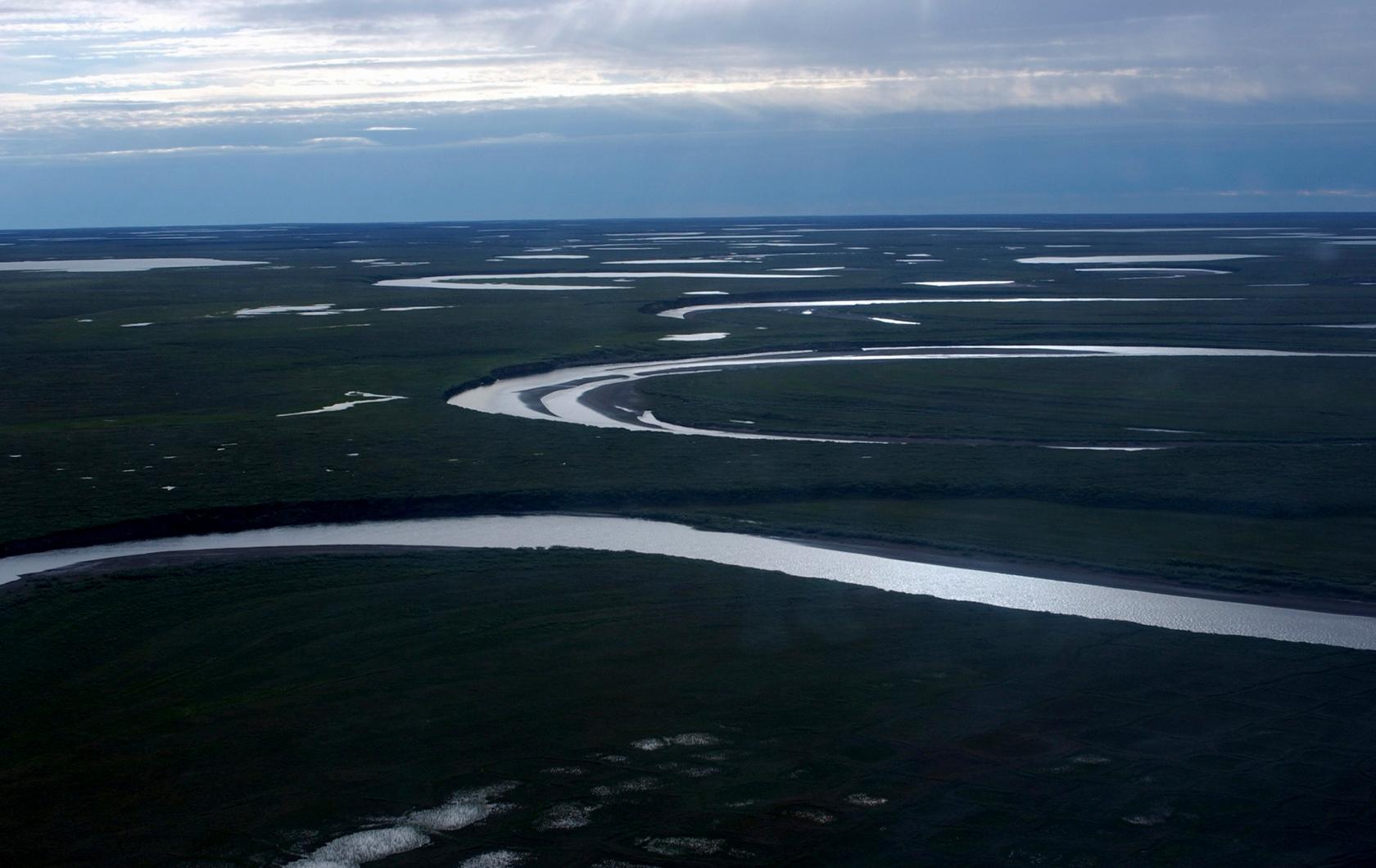 FILE - This photo provided by the United States Geological Survey shows Fish Creek through the National Petroleum Reserve-Alaska, managed by the Bureau of Land Management, on Alaska's North Slope on July 8, 2004. (David W. Houseknecht/United States Geological Survey via AP, File)