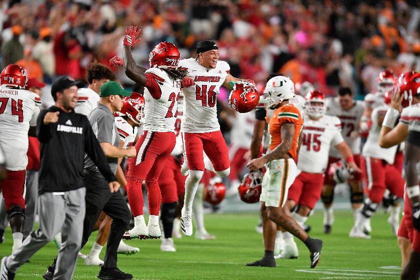 FILE - Louisville players celebrate beating Miami in an NCAA college football game, Oct. 17, 2025, in Miami Gardens, Fla. (AP Photo/Michael Laughlin, File)