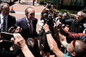 Steven F. Molo, attorney for Elon Musk, second from left, speaks to reporters outside the U.S. District Court, Monday, May 18, 2026, in Oakland, Calif. (AP Photo/Nathan Weyland)