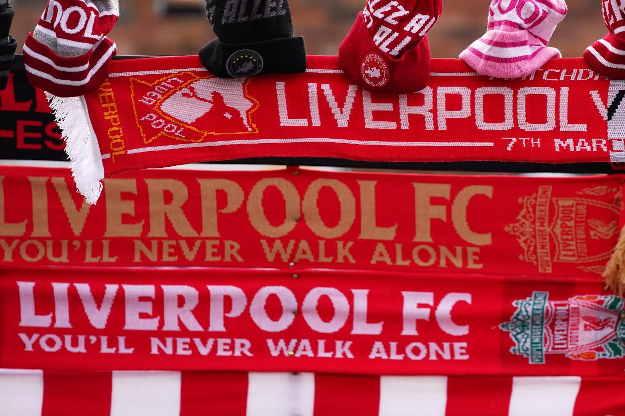 FILE - Merchandise is displayed for sale ahead the English Premier League soccer match between Liverpool and Bournemouth at Anfield stadium in Liverpool, England, Saturday, March 7, 2020. (AP Photo/Jon Super, File)