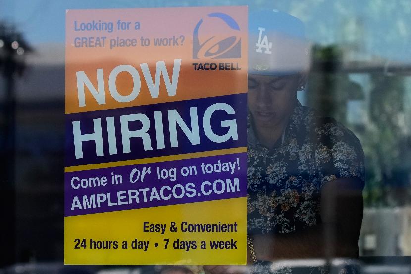 A hiring sign is displayed at a restaurant in Niles, Ill., Thursday, May 14, 2026. (AP Photo/Nam Y. Huh)