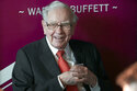 FILE - Warren Buffett, chairman and CEO of Berkshire Hathaway, smiles as he plays bridge following the annual Berkshire Hathaway shareholders meeting in Omaha, Neb., on May 5, 2019. Warren Buffett's company bet more on high-tech darlings Apple and Amazon during the second quarter of 2022 while also investing billions in old school oil producers Occidental Petroleum and Chevron. (AP Photo/Nati Harnik, File)