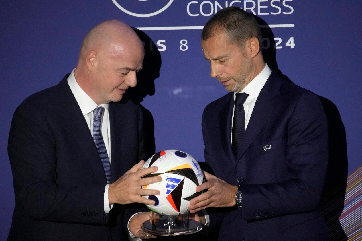 FILE - UEFA President Aleksander Ceferin, right, and FIFA President Gianni Infantino pose during the 48th UEFA congress in Paris, Thursday, Feb. 8, 2024. (AP Photo/Christophe Ena, File)