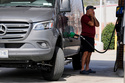 Ray Ruda fills his van with fuel at a gas station Wednesday, March 25, 2026, in Brentwood, Tenn. (AP Photo/George Walker IV)