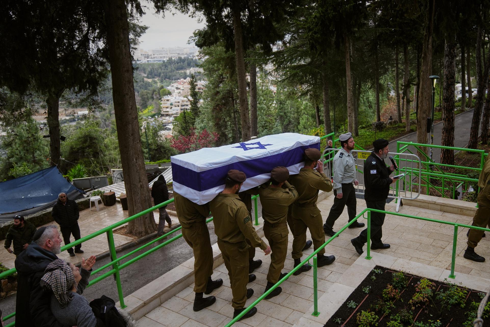 Israeli soldiers carry the flag-draped casket of Staff Sgt. Ori Greenberg who was killed in combat in Lebanon, during his funeral at Mount Herzl military cemetery in Jerusalem Thursday, March 26, 2026. (AP Photo/Mahmoud Illean)