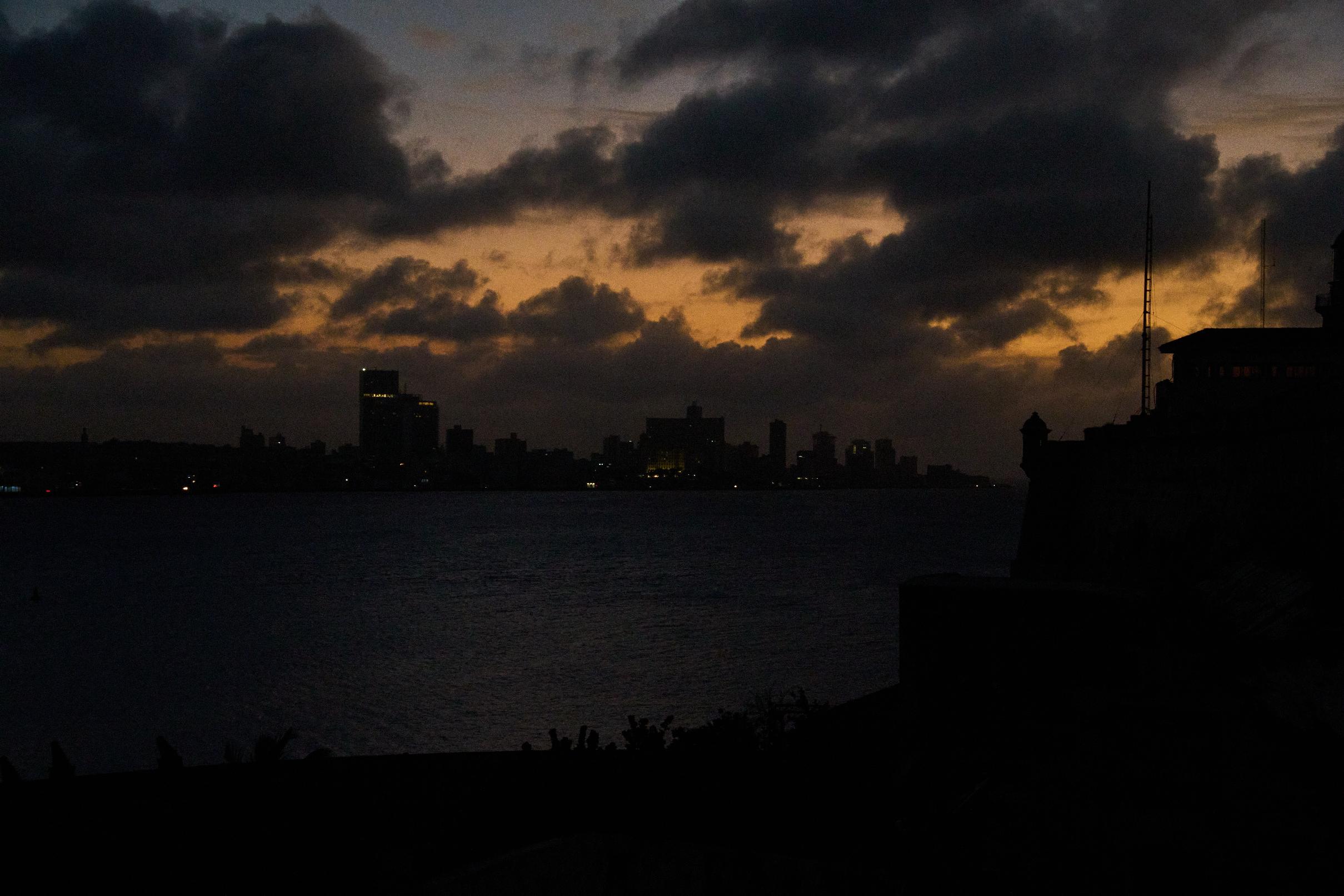 Clouds gather above Havana during a blackout, Wednesday, March 4, 2026. (AP Photo/Ramon Espinosa)