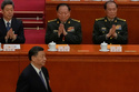 Chinese President Xi Jinping, bottom left, walks past then Vice Chairmen of China's Central Military Commission Zhang Youxia, top center, and He Weidong, top right, during a session of the National People's Congress (NPC) at the Great Hall of the People, in Beijing, China, March 12, 2023. (AP Photo/Andy Wong)