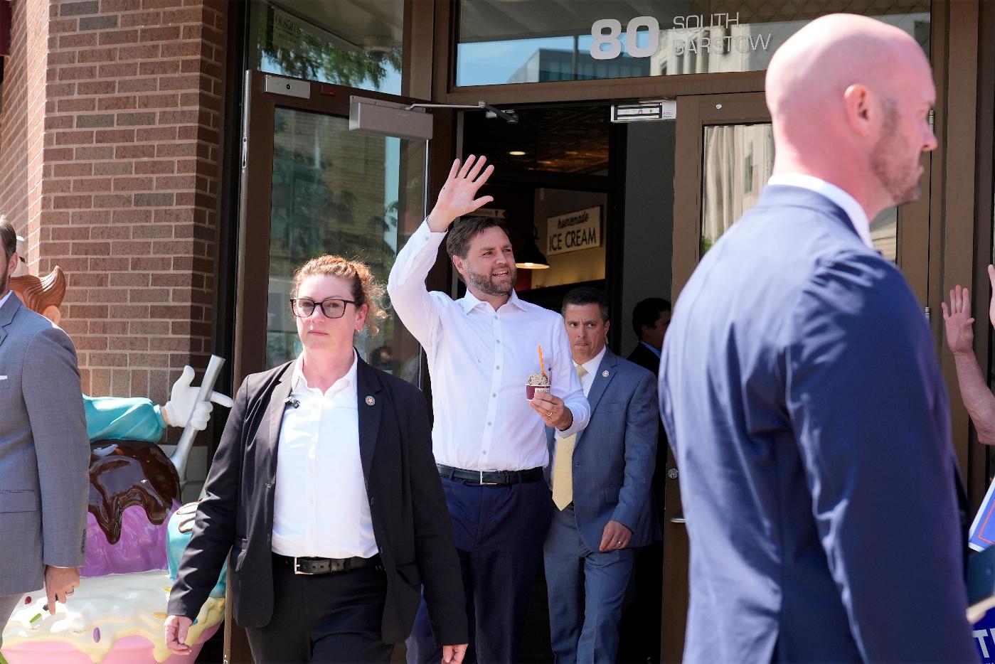 Republican vice presidential nominee Sen. JD Vance, R-Ohio, waves as he leaves with ice cream at Olson's Ice Cream Wednesday, Aug. 7, 2024, in Eau Claire, Wis. (AP Photo/Alex Brandon)