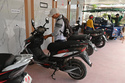 Giraldo Lazaro Perez Paret, who works in the tourism sector, recharges his electric motorcycle in Santa Clara, Cuba, Saturday, May 2, 2026. (AP Photo/Jorge Luis Banos)