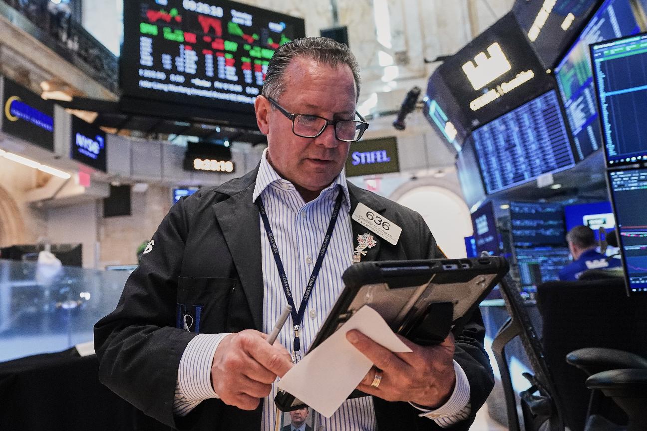 Trader Edward Curran works on the floor of the New York Stock Exchange, Tuesday, June 16, 2026. (AP Photo/Richard Drew)
