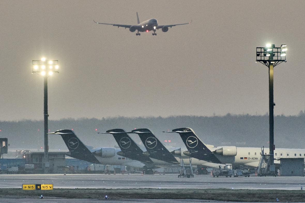 FILE - A plane comes in for landing as Lufthansa aircraft are parked at the airport due to a two-day strike by Lufthansa pilots, in Frankfurt, Germany, Thursday, March 12, 2026. (AP Photo/Michael Probst, File)
