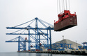 FILE - A container is lifted by a crane backdropped by the construction of the Chinese-funded port, in Chancay, Peru, Oct. 29, 2024. (AP Photo/Guadalupe Pardo, File)