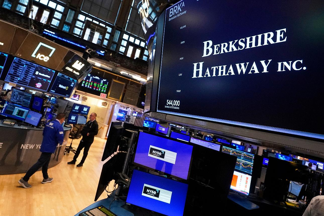 FILE - The logo for Berkshire Hathaway Inc. appears above a trading post on the floor of the New York Stock Exchange, Monday, May 5, 2025. (AP Photo/Richard Drew, File)