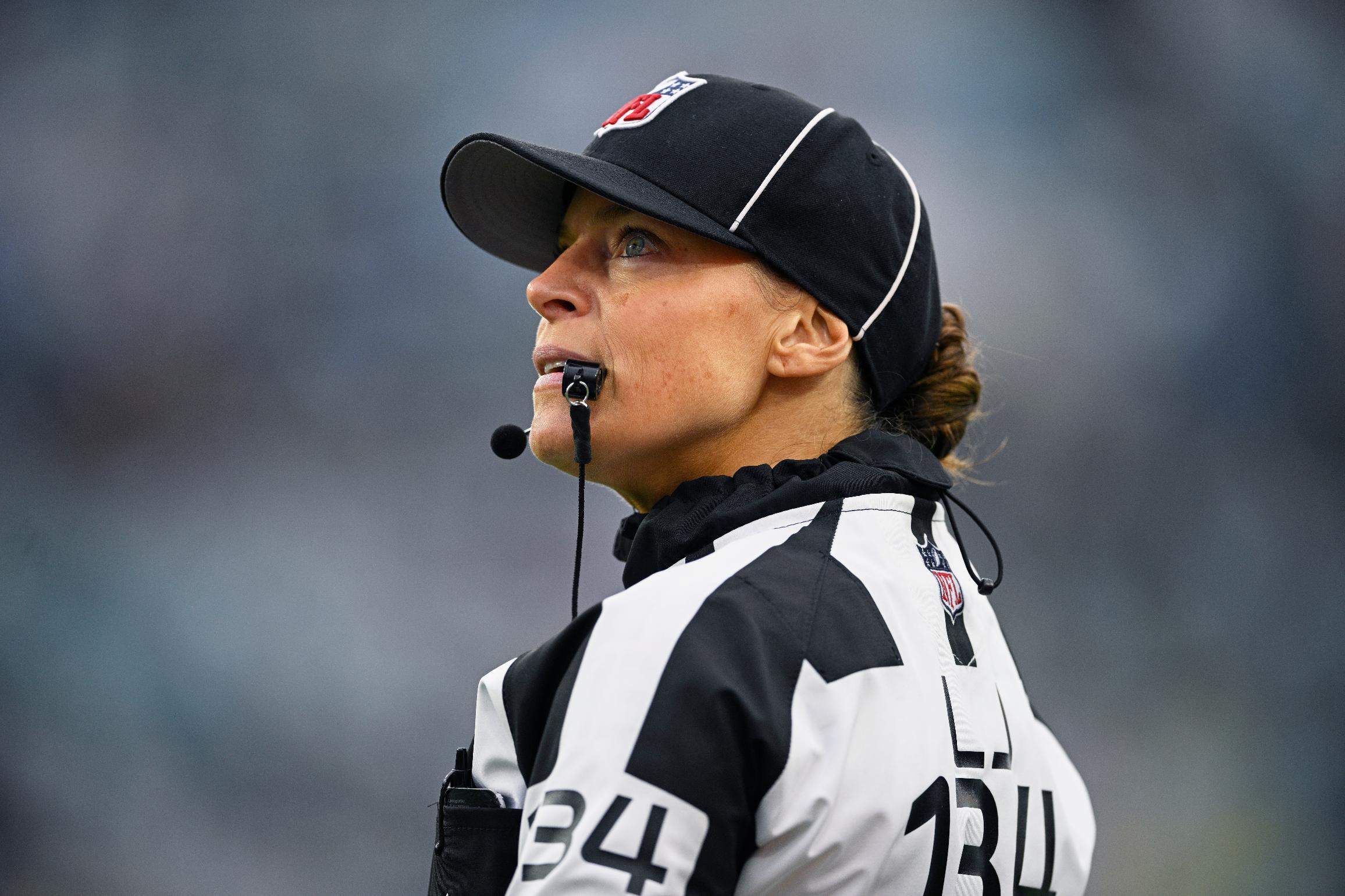 FILE - Line judge Robin DeLorenzo looks on during the second half of an NFL football game between the Jacksonville Jaguars and the Tennessee Titans, Dec. 29, 2024, in Jacksonville, Fla. (AP Photo/Phelan M. Ebenhack, File)