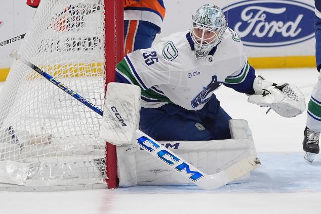 Vancouver Canucks goaltender Thatcher Demko protects the net during the second period of an NHL hockey game against the New York Islanders Wednesday, March 26, 2025, in Elmont, N.Y. (AP Photo/Frank Franklin II)