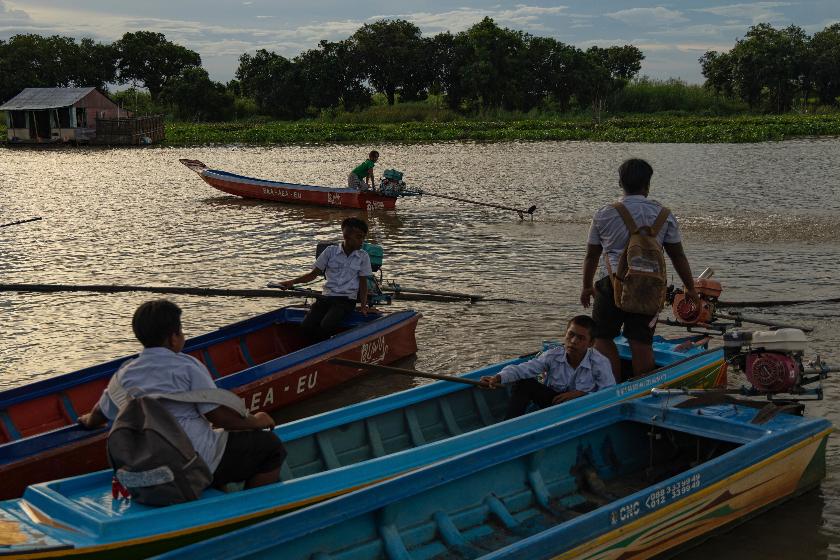 Students board school boats to return to their homes in a floating village on Cambodia's Tonle Sap Lake on Monday, June 29, 2026. (AP Photo/Anton L. Delgado)