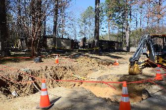 Digging equipment is parked outside a house in Jackson, Miss., Wednesday, Feb. 21, 2024, after it was damaged by a natural gas explosion Saturday, Jan. 27, 2024. (Vickie D. King/Mississippi Today via AP)