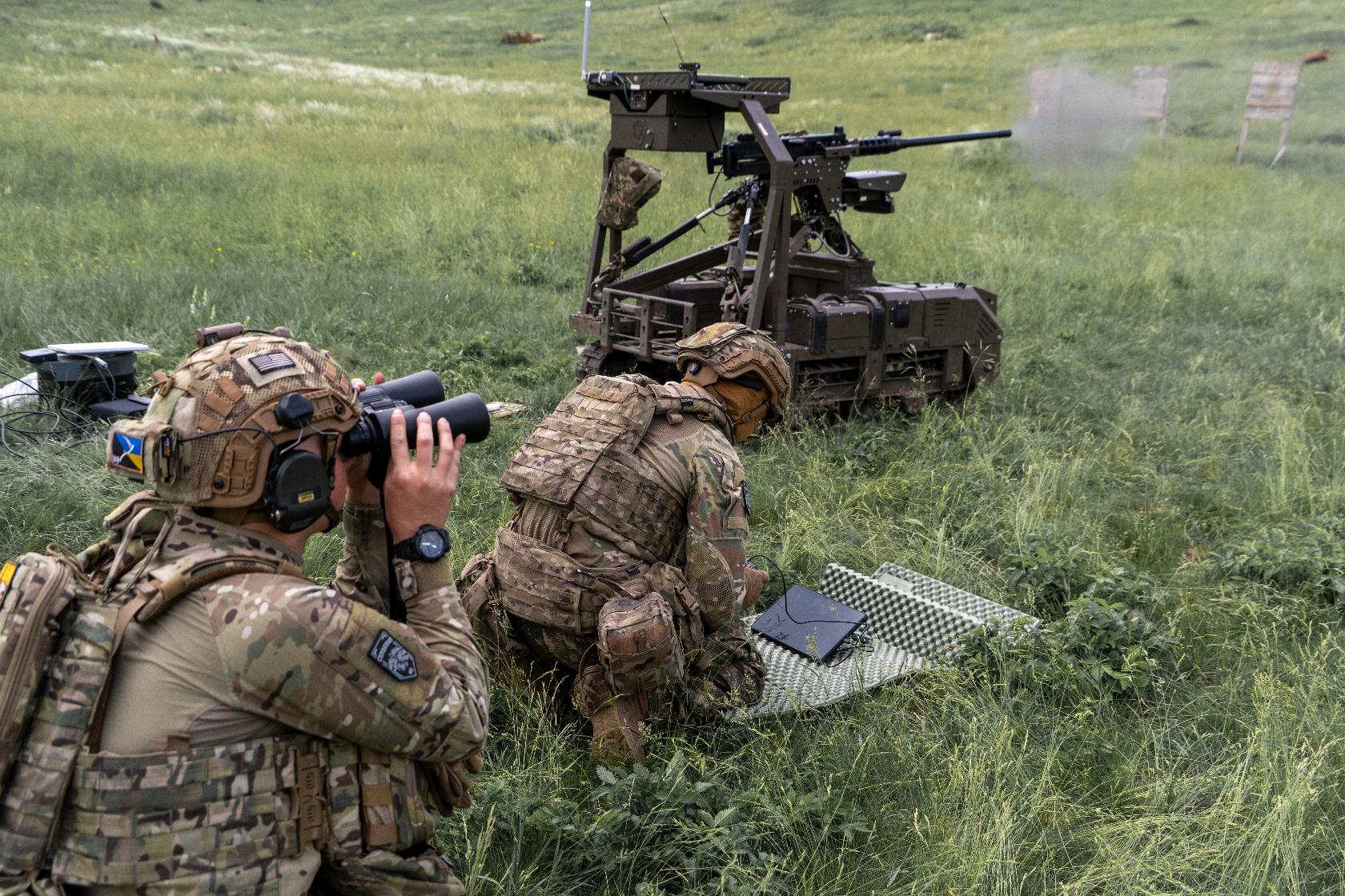 Ukrainian servicemen of the Cerberus Ground Unmanned Systems Company of the 60th Separate Mechanized Brigade, Third Army Corps, conduct a drill with a combat ground drone during a training at the polygon in Kharkiv region, Ukraine, Sunday, May 24, 2026. (AP Photo/Andrii Marienko)