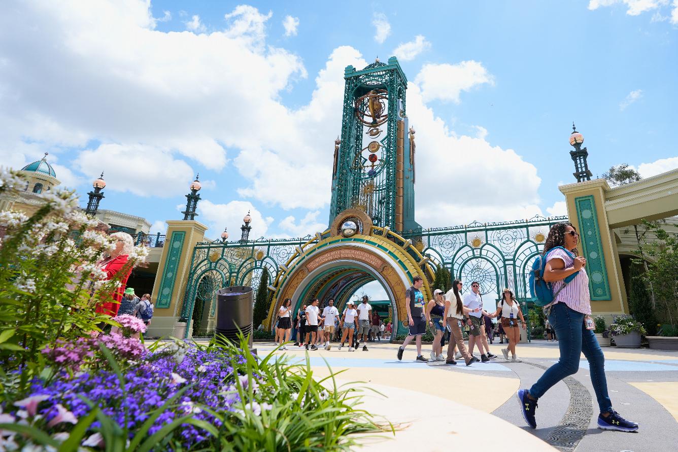 FILE - Guests arrive at the main entrance to Epic Universe Theme Park at Universal Resort Orlando, April 10, 2025, in Orlando, Fla. (AP Photo/John Raoux, File)