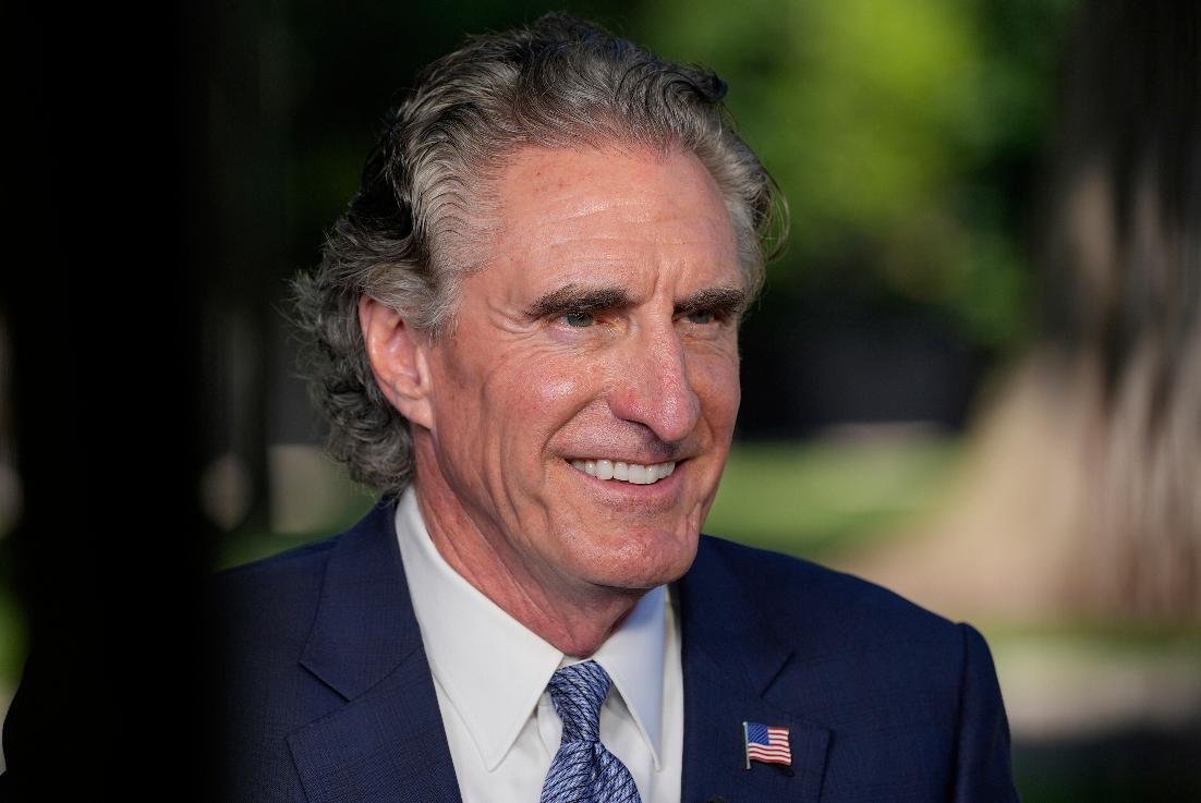 Interior Secretary Doug Burgum talks with CNN's Kaitlan Collins during television interview at the White House, Tuesday, Aug. 26, 2025, in Washington. (AP Photo/Alex Brandon)