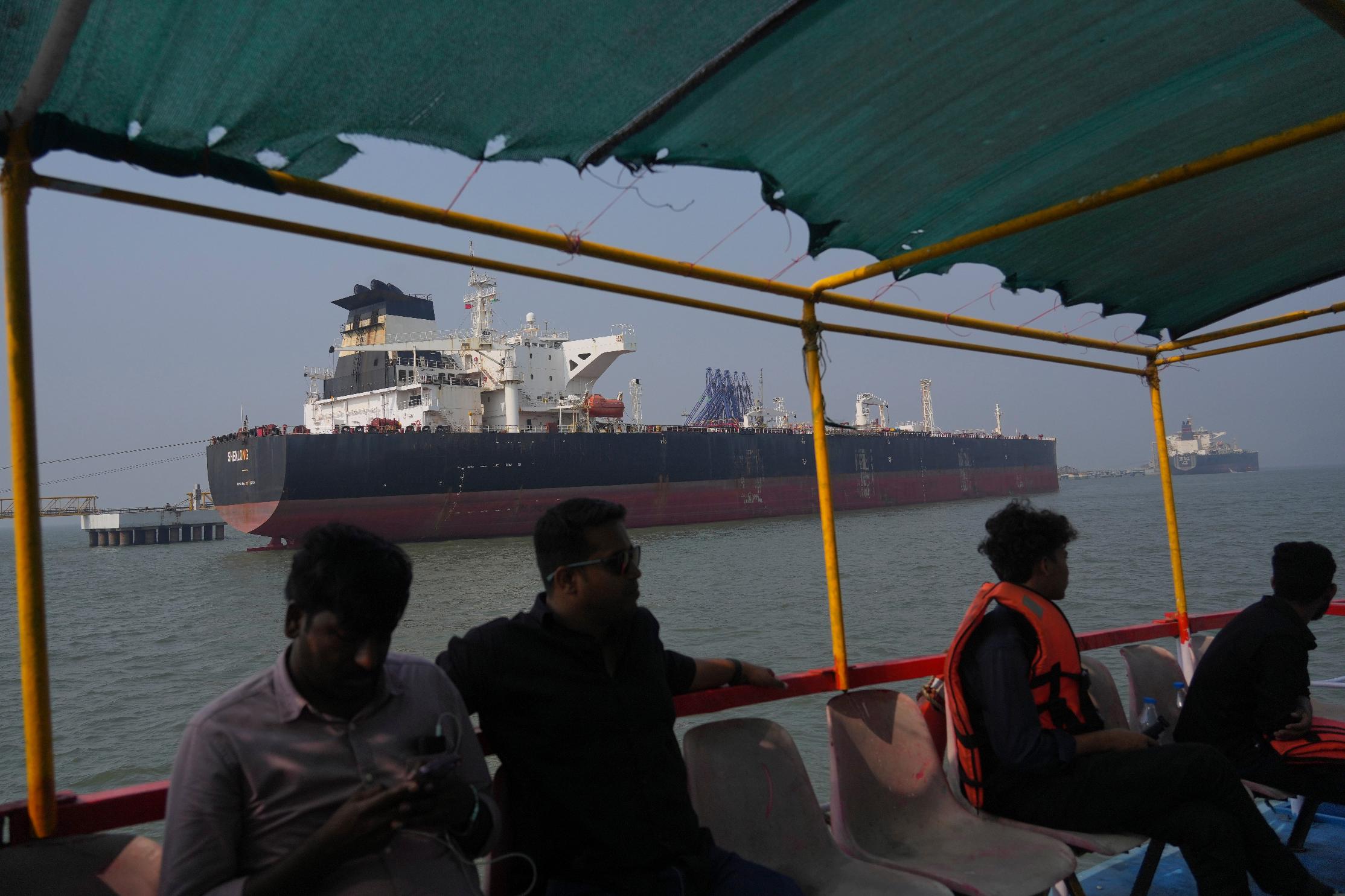 FILE - Liberia-flagged tanker Shenlong Suezmax, carrying crude oil from Saudi Arabia, that arrived clearing the Strait of Hormuz, is seen at the Mumbai Port in Mumbai, India, Thursday, March 12, 2026. (AP Photo/Rafiq Maqbool, file)