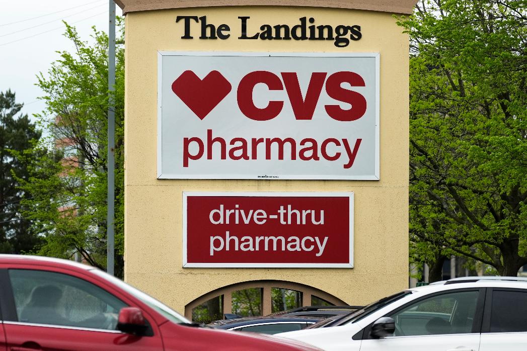 FILE - CVS pharmacy and drive-thru signs are seen outside of CVS store in Park Ridge, Ill., Monday, April 29, 2024. (AP Photo/Nam Y. Huh, file)