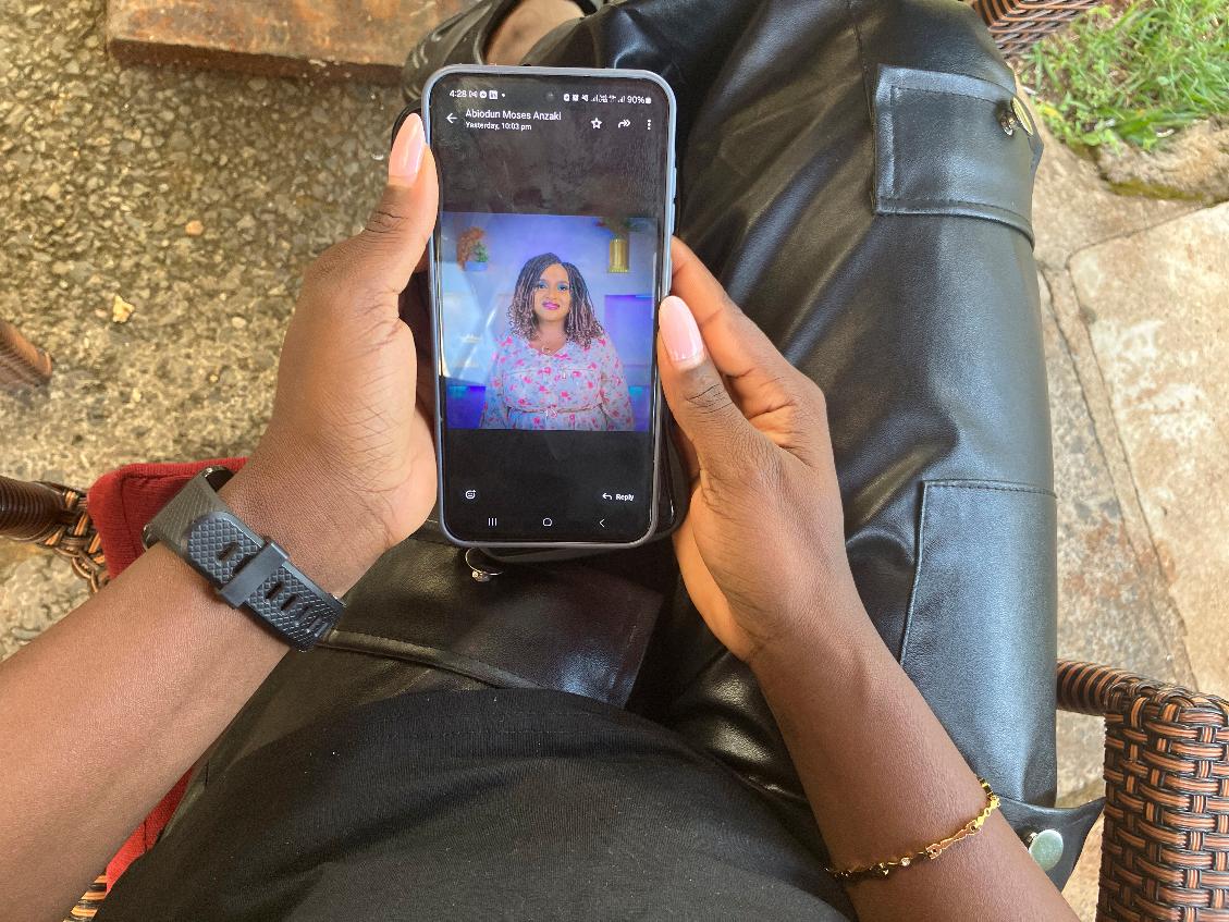 A Kenya-based content moderator views in Nairobi, Kenya, Tuesday, March 11, 2025, a photo of a former colleague, Ladi Anzaki Olubunm, who died in unclear circumstances (AP Photo/Evelyne Musambi)