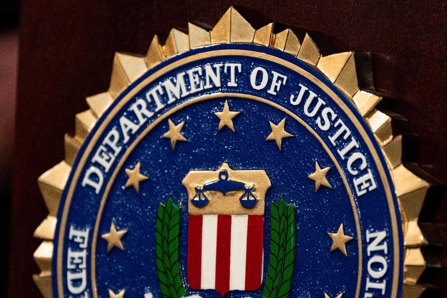 FILE - An FBI seal is displayed on a podium before a news conference at the field office in Portland, Ore., Thursday, Jan. 16, 2025. (AP Photo/Jenny Kane, File)