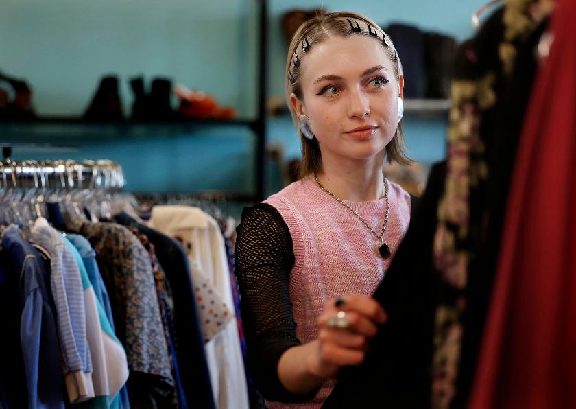 FILE - Miranda Lewin shops for clothes at Pib's Exchange in Salt Lake City, Utah, April 15, 2022. (Laura Seitz/The Deseret News via AP)